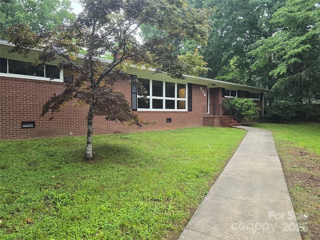520 Crestview Dr, Albemarle, NC 28001 - view of front facade with crawl space, brick siding, and a front yard