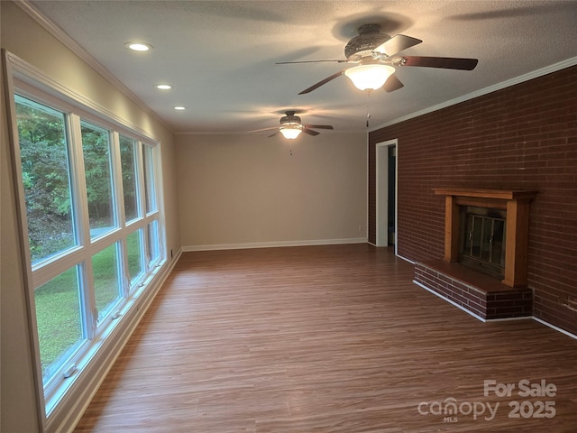 520 Crestview Dr, Albemarle, NC 28001 - unfurnished living room with plenty of natural light, ornamental molding, baseboards, wood finished floors, and ceiling fan