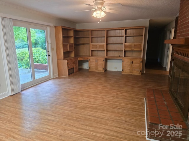520 Crestview Dr, Albemarle, NC 28001 - unfurnished living room featuring light wood-type flooring, crown molding, a ceiling fan, and a fireplace