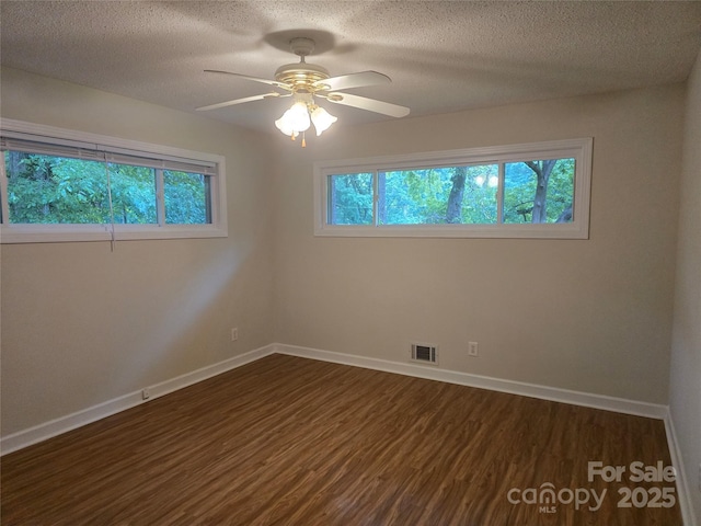 520 Crestview Dr, Albemarle, NC 28001 - unfurnished room featuring dark wood-style floors, baseboards, a ceiling fan, and a textured ceiling