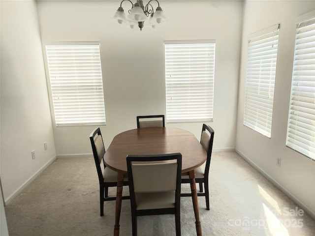 2061 Argentum Ave, Fort Mill, SC 29707 - dining space featuring light carpet, a chandelier, and baseboards