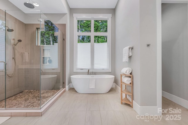 128 Saddle Ridge Dr, Alexander, NC 28701 - full bathroom featuring a shower stall and a freestanding tub