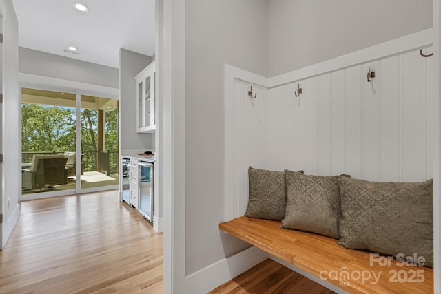 128 Saddle Ridge Dr, Alexander, NC 28701 - mudroom featuring light wood-style flooring, wine cooler, and recessed lighting