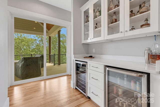 128 Saddle Ridge Dr, Alexander, NC 28701 - indoor dry bar with wine cooler and light wood-style flooring