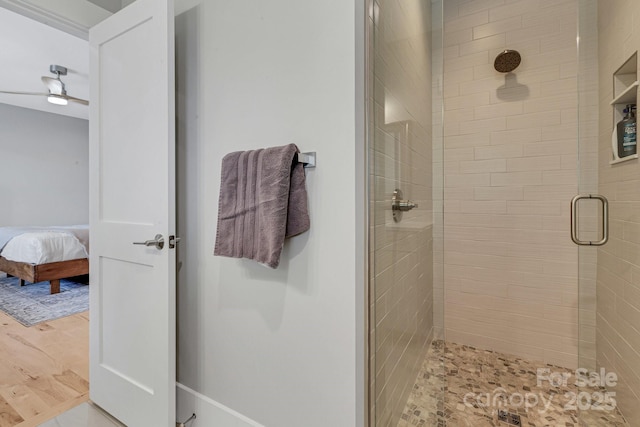 128 Saddle Ridge Dr, Alexander, NC 28701 - full bathroom featuring a stall shower, connected bathroom, and wood finished floors