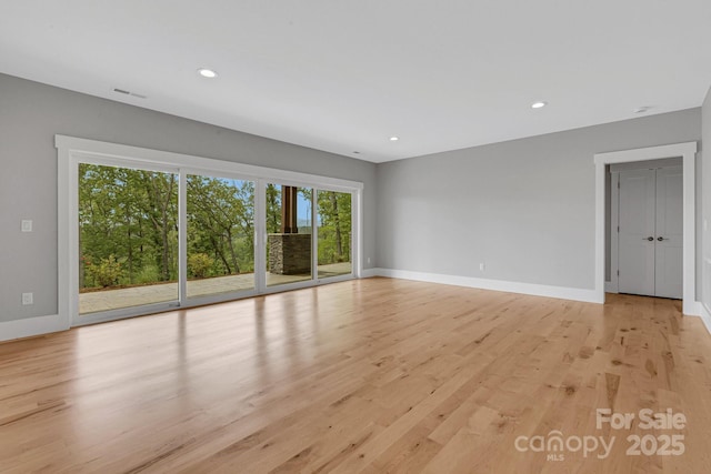 128 Saddle Ridge Dr, Alexander, NC 28701 - empty room featuring light wood-type flooring and recessed lighting