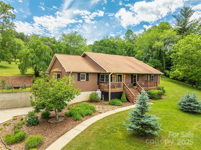 575 Upper Glady Fork Rd, Candler, NC 28715 - ranch-style home with covered porch, a front yard, a shingled roof, and stairway