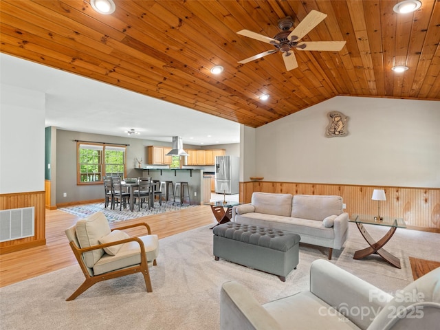 575 Upper Glady Fork Rd, Candler, NC 28715 - living area featuring a wainscoted wall, wood ceiling, vaulted ceiling, wood walls, and a ceiling fan