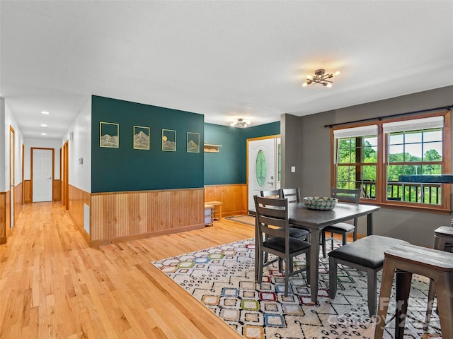 575 Upper Glady Fork Rd, Candler, NC 28715 - dining area with wood finished floors, a wainscoted wall, and wooden walls