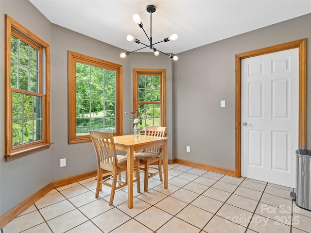 575 Upper Glady Fork Rd, Candler, NC 28715 - dining room featuring a chandelier, baseboards, and light tile patterned flooring