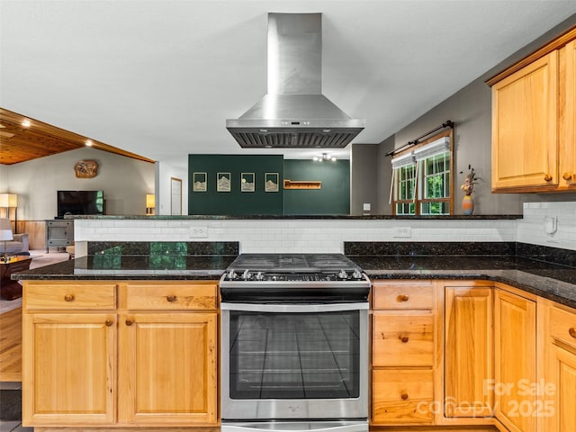 575 Upper Glady Fork Rd, Candler, NC 28715 - kitchen featuring gas range, exhaust hood, backsplash, open floor plan, and a peninsula