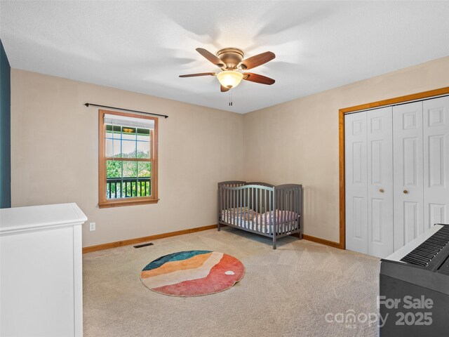 575 Upper Glady Fork Rd, Candler, NC 28715 - bedroom featuring carpet floors, a closet, baseboards, and ceiling fan