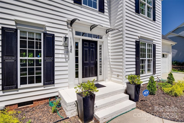 view of exterior entry featuring crawl space
