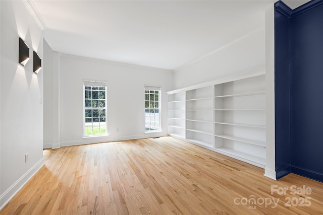1134 Blueberry Ln, Charlotte, NC 28226 - empty room featuring wood finished floors, ornamental molding, and built in features