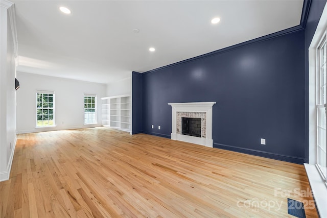 1134 Blueberry Ln, Charlotte, NC 28226 - unfurnished living room featuring light wood finished floors, a fireplace, and recessed lighting