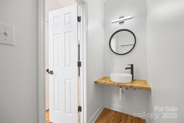 1134 Blueberry Ln, Charlotte, NC 28226 - bathroom with a sink and wood finished floors