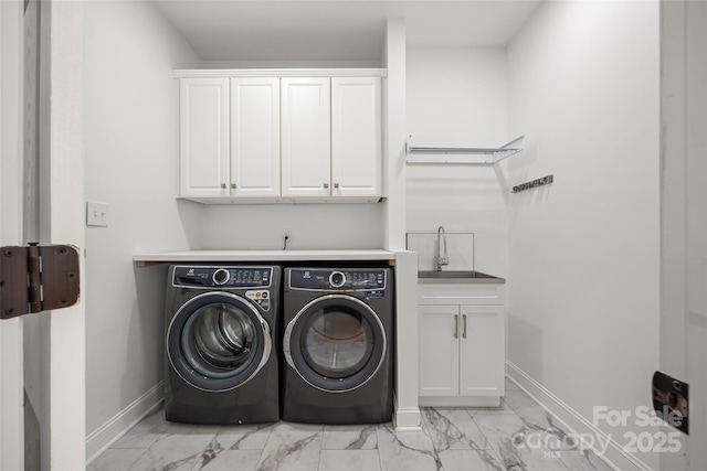 1134 Blueberry Ln, Charlotte, NC 28226 - laundry area featuring light marble finish flooring, washing machine and dryer, and cabinet space