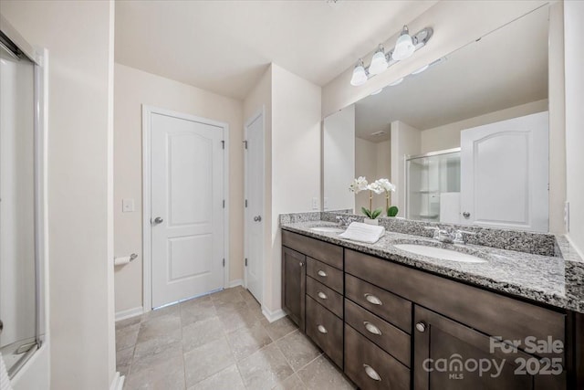 5366 Meadowcroft Way, Fort Mill, SC 29708 - bathroom with baseboards, double vanity, and an enclosed shower