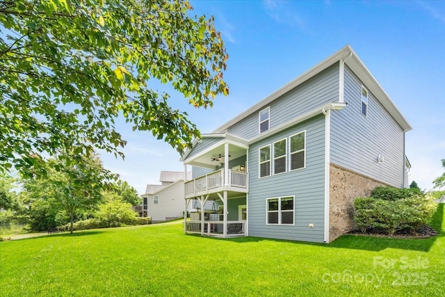 5366 Meadowcroft Way, Fort Mill, SC 29708 - back of property with a balcony, a ceiling fan, brick siding, and a lawn
