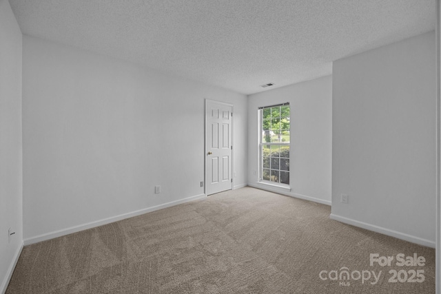 1321 Land Grant Rd, Charlotte, NC 28217 - unfurnished room with a textured ceiling, carpet flooring, and baseboards