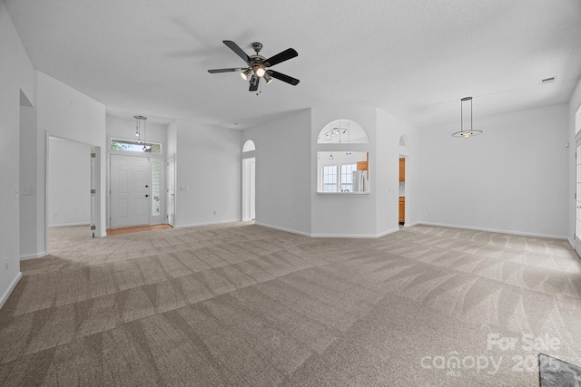 1321 Land Grant Rd, Charlotte, NC 28217 - unfurnished living room featuring light colored carpet, ceiling fan, healthy amount of natural light, and baseboards