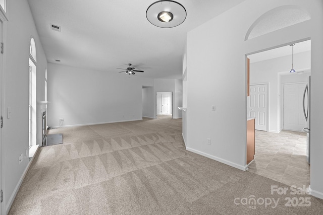 1321 Land Grant Rd, Charlotte, NC 28217 - unfurnished living room featuring light carpet, ceiling fan, and baseboards