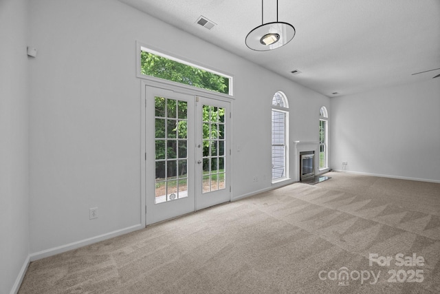 1321 Land Grant Rd, Charlotte, NC 28217 - unfurnished living room featuring carpet flooring, french doors, baseboards, and a fireplace with flush hearth