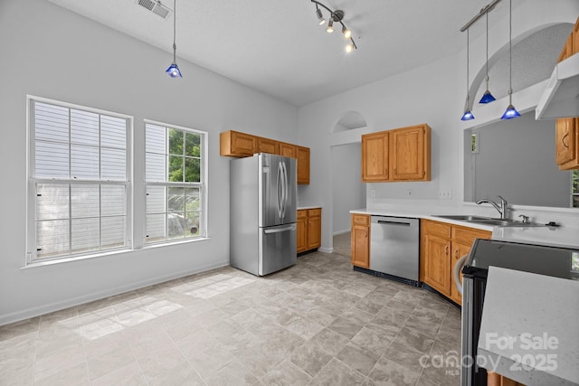 1321 Land Grant Rd, Charlotte, NC 28217 - kitchen featuring stainless steel appliances, baseboards, hanging light fixtures, and light countertops