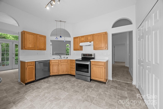 1321 Land Grant Rd, Charlotte, NC 28217 - kitchen featuring stainless steel appliances, under cabinet range hood, light countertops, a sink, and plenty of natural light