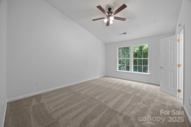 1321 Land Grant Rd, Charlotte, NC 28217 - carpeted empty room with vaulted ceiling, a ceiling fan, baseboards, and a textured ceiling