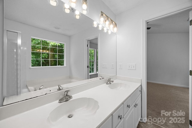 1321 Land Grant Rd, Charlotte, NC 28217 - full bath featuring double vanity, a textured ceiling, and a bath