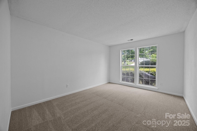 1321 Land Grant Rd, Charlotte, NC 28217 - empty room with carpet floors, a textured ceiling, and baseboards