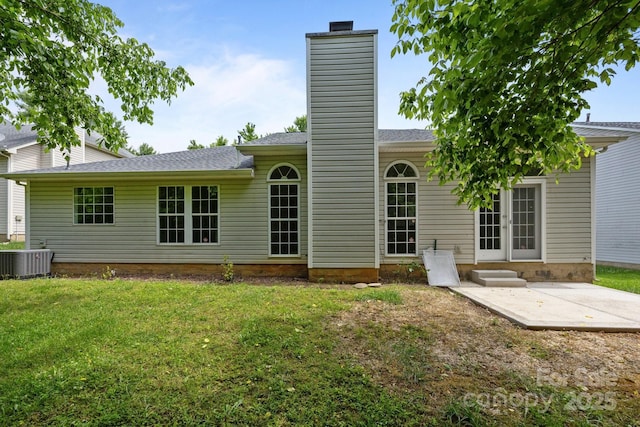 1321 Land Grant Rd, Charlotte, NC 28217 - back of property with a chimney, a lawn, a patio, french doors, and central AC unit