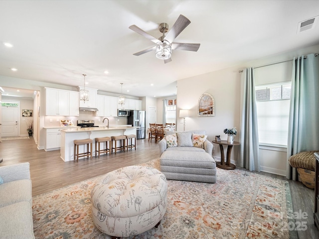 1456 Augustus Beamon Dr, Indian Trail, NC 28079 - living room with recessed lighting, a ceiling fan, light wood finished floors, and baseboards