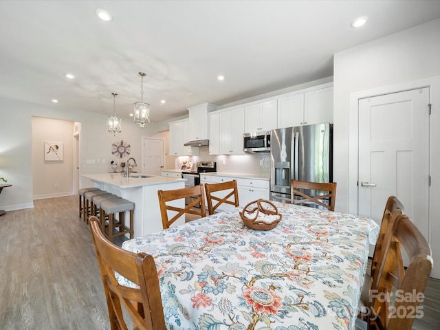 1456 Augustus Beamon Dr, Indian Trail, NC 28079 - dining room with light wood-style floors, recessed lighting, and baseboards