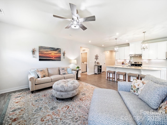 1456 Augustus Beamon Dr, Indian Trail, NC 28079 - living area with wood finished floors, baseboards, ceiling fan, recessed lighting, and washer / clothes dryer