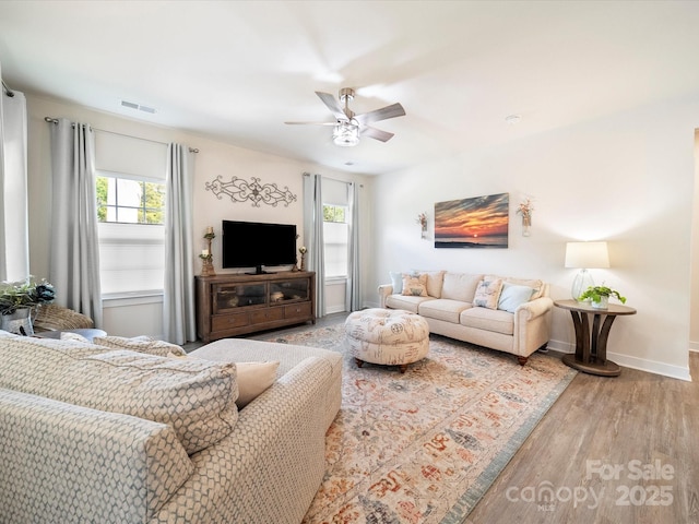 1456 Augustus Beamon Dr, Indian Trail, NC 28079 - living room with wood finished floors, a ceiling fan, and baseboards