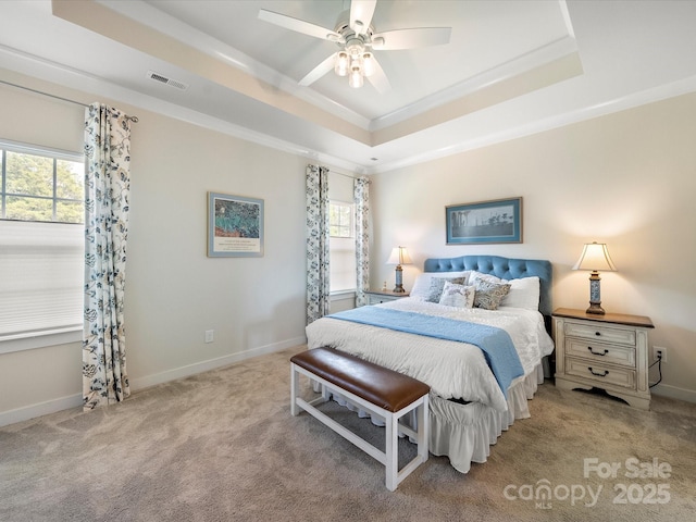 1456 Augustus Beamon Dr, Indian Trail, NC 28079 - carpeted bedroom with a tray ceiling, multiple windows, ornamental molding, and baseboards