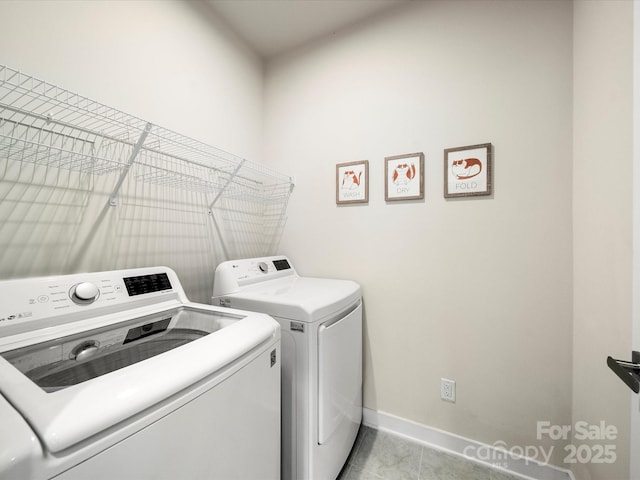 1456 Augustus Beamon Dr, Indian Trail, NC 28079 - clothes washing area featuring washing machine and dryer, baseboards, and light tile patterned floors