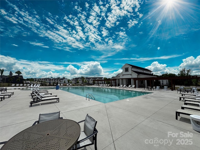 1456 Augustus Beamon Dr, Indian Trail, NC 28079 - community pool with a patio area and outdoor dining space