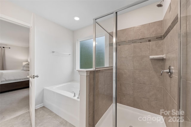 15630 Oleander Dr, Charlotte, NC 28278 - bathroom with connected bathroom, a stall shower, a garden tub, tile patterned flooring, and recessed lighting
