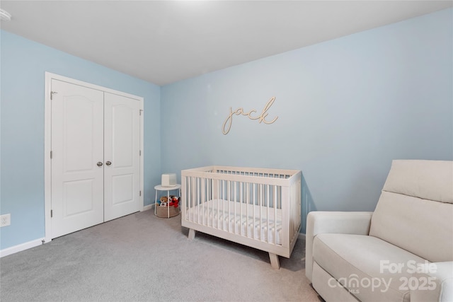 15630 Oleander Dr, Charlotte, NC 28278 - bedroom featuring carpet, a closet, a nursery area, and baseboards