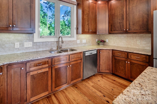 204 Ridge Dr Unit 12 12-1 12-2, Troy, NC 27371 - kitchen with stainless steel appliances, a sink, light wood-style floors, and tasteful backsplash