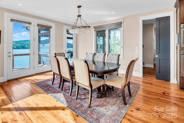204 Ridge Dr Unit 12 12-1 12-2, Troy, NC 27371 - dining area featuring light wood-style floors, a chandelier, baseboards, and recessed lighting