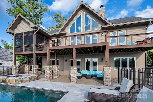 204 Ridge Dr Unit 12 12-1 12-2, Troy, NC 27371 - rear view of property with an outdoor hangout area, a sunroom, stucco siding, and a patio area