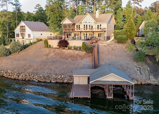 204 Ridge Dr Unit 12 12-1 12-2, Troy, NC 27371 - back of property with a deck with water view, a chimney, and boat lift