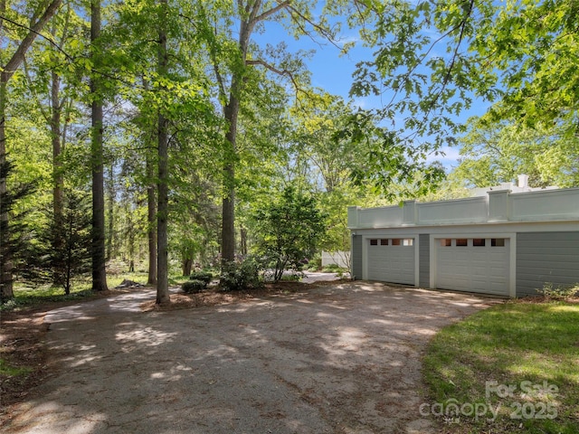 316 Vanderbilt Rd, Asheville, NC 28803 - view of yard featuring asphalt driveway and an attached garage