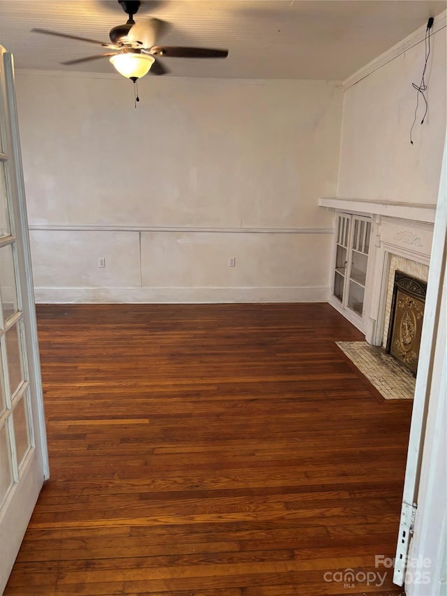273 E Main Ave, Taylorsville, NC 28681 - unfurnished living room featuring dark wood-type flooring, ceiling fan, a fireplace with flush hearth, and baseboards