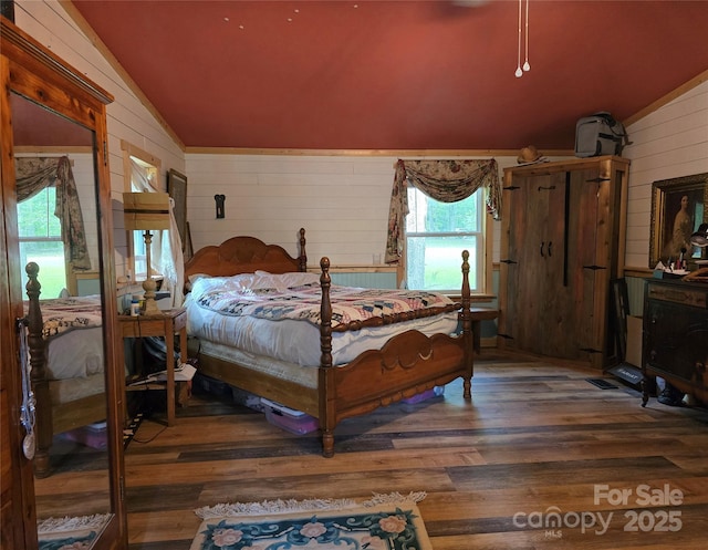 850 Meadowbend Dr, York, SC 29745 - bedroom featuring lofted ceiling, wooden walls, and wood finished floors