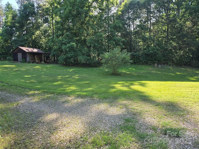 850 Meadowbend Dr, York, SC 29745 - view of grassy yard featuring an outbuilding and a forest view